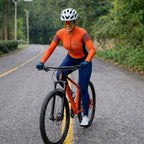 Macacão Ciclismo Feminino Xama Performance Vélor — Gel 20D, UV50+ e Alta Visibilidade Laranja