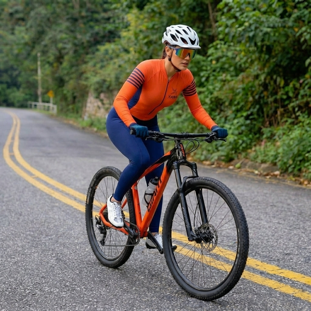 Macacão Ciclismo Feminino Xama Performance Vélor — Gel 20D, UV50+ e Alta Visibilidade Laranja